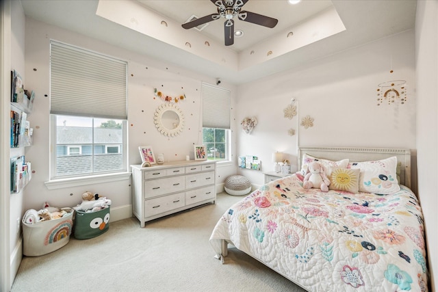 1035 Waverly St Unit B, Houston, TX 77008 - bedroom with multiple windows, light carpet, a tray ceiling, and ceiling fan