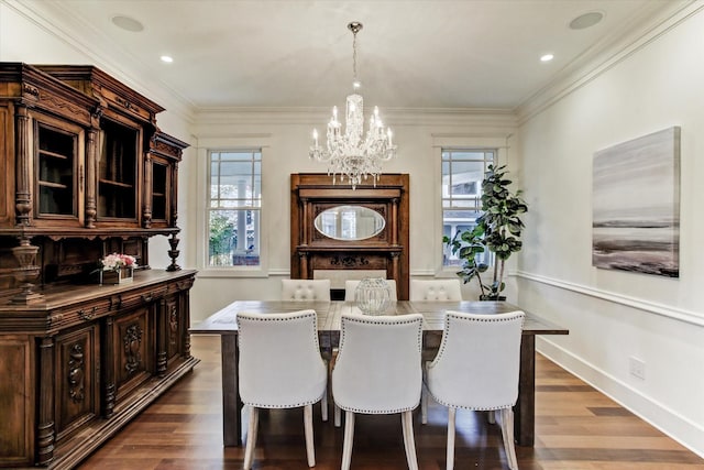2317 Ashland St, Houston, TX 77008 - dining space with a chandelier, dark wood-type flooring, crown molding, and recessed lighting