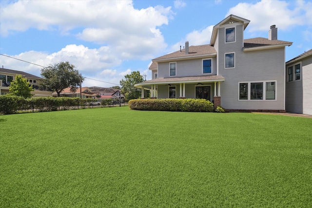 2317 Ashland St, Houston, TX 77008 - back of property featuring a chimney, a lawn, and a shingled roof
