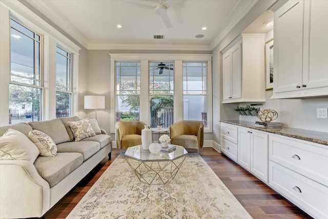 2317 Ashland St, Houston, TX 77008 - living area featuring a ceiling fan, dark wood-style flooring, and crown molding