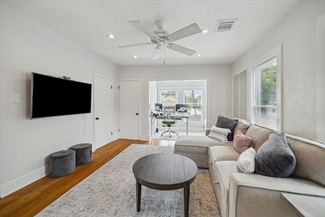 2317 Ashland St, Houston, TX 77008 - living area with healthy amount of natural light, wood finished floors, a ceiling fan, and recessed lighting