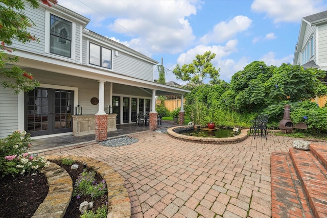 2317 Ashland St, Houston, TX 77008 - view of patio featuring french doors