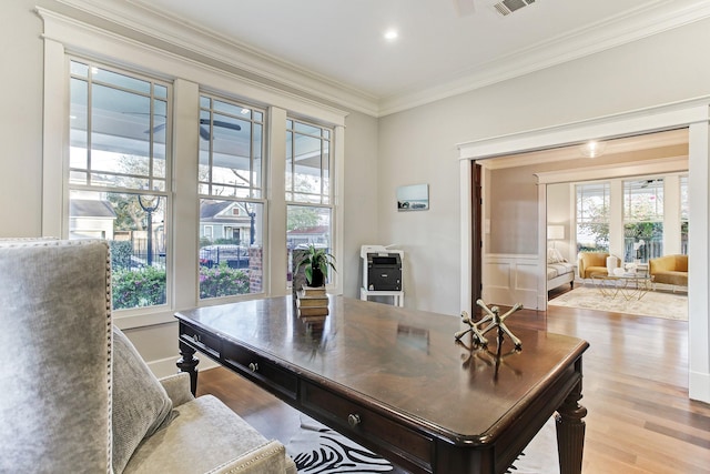 2317 Ashland St, Houston, TX 77008 - home office featuring ornamental molding, healthy amount of natural light, wood finished floors, and a wainscoted wall
