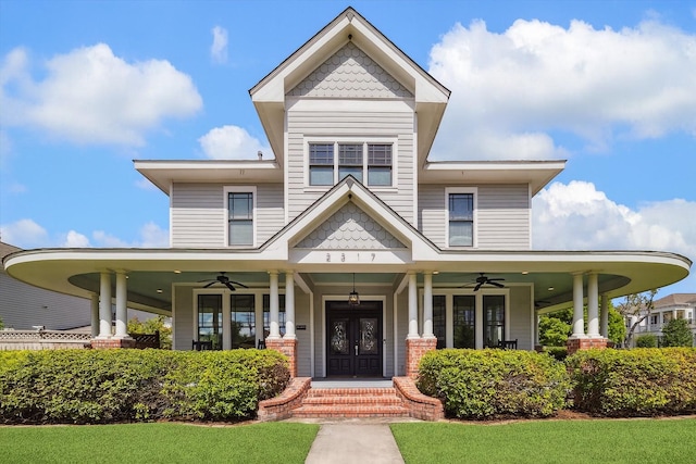2317 Ashland St, Houston, TX 77008 - victorian home featuring ceiling fan, a porch, and a front lawn