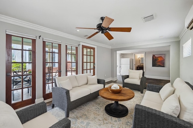 2317 Ashland St, Houston, TX 77008 - living room with ceiling fan, ornamental molding, recessed lighting, and wood finished floors