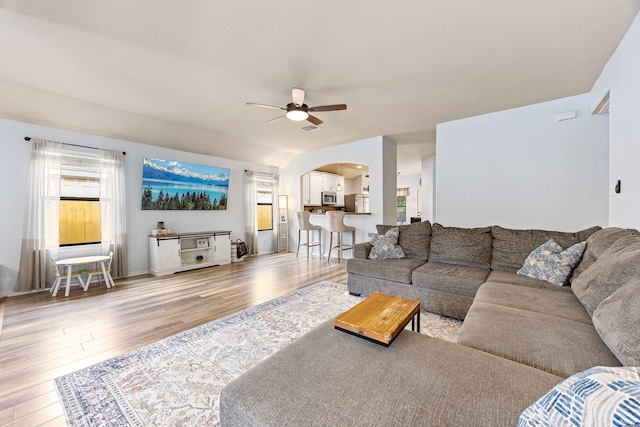 2715 Lexington Park Dr, Spring, TX 77373 - living room featuring arched walkways, hardwood / wood-style flooring, and a ceiling fan