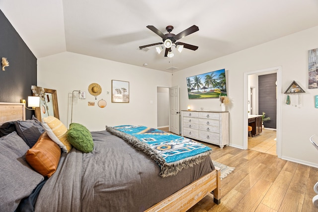 2715 Lexington Park Dr, Spring, TX 77373 - bedroom featuring light wood-type flooring, lofted ceiling, ceiling fan, and ensuite bathroom