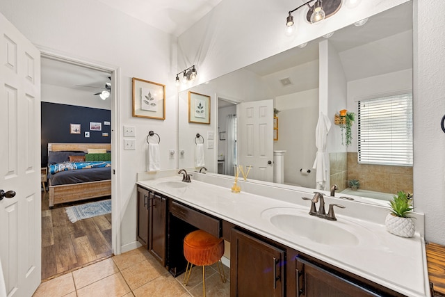 2715 Lexington Park Dr, Spring, TX 77373 - full bath with ceiling fan, connected bathroom, double vanity, a garden tub, and tile patterned flooring