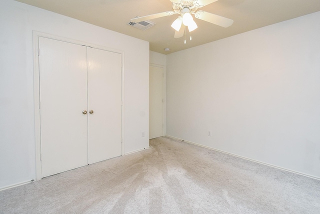 2715 Trinity Glen Ln, Houston, TX 77047 - unfurnished bedroom featuring light carpet, a closet, and a ceiling fan