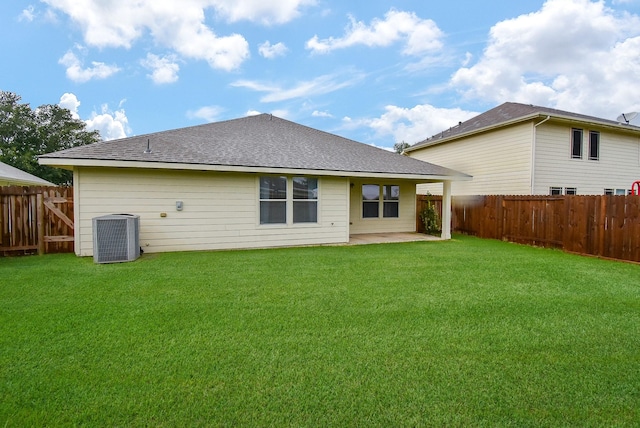 2715 Trinity Glen Ln, Houston, TX 77047 - back of house with a fenced backyard, a patio, and a shingled roof