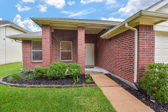2715 Trinity Glen Ln, Houston, TX 77047 - property entrance featuring brick siding, a garage, and a shingled roof