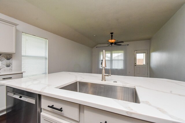 2715 Trinity Glen Ln, Houston, TX 77047 - kitchen with dishwashing machine, ceiling fan, and light stone counters