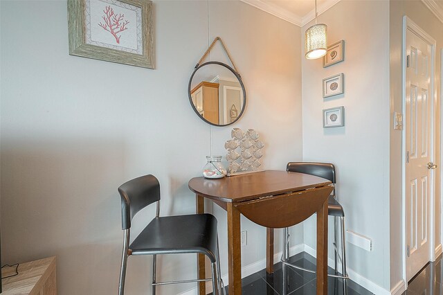 6102 Seawall Blvd Unit 252, Galveston, TX 77551 - dining space featuring ornamental molding and granite tiled floors