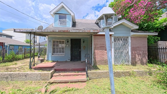 3307 Omega St, Houston, TX 77022 - view of front facade with a porch and brick siding
