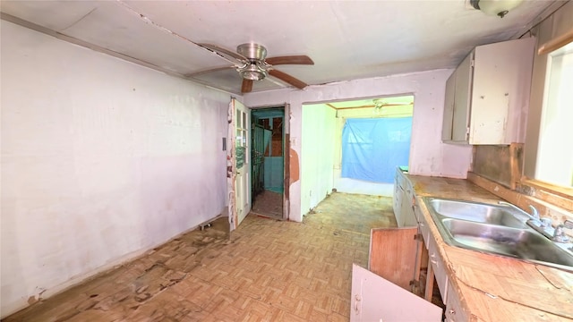 3307 Omega St, Houston, TX 77022 - kitchen featuring a ceiling fan and light countertops