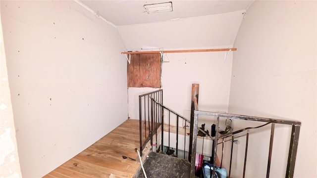 3307 Omega St, Houston, TX 77022 - stairway featuring wood finished floors and vaulted ceiling