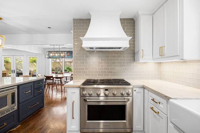12215 Cobblestone Dr, Houston, TX 77024 - kitchen with appliances with stainless steel finishes, custom range hood, white cabinets, and backsplash