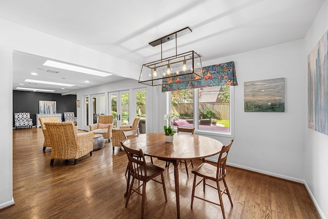 12215 Cobblestone Dr, Houston, TX 77024 - dining space featuring wood finished floors, a chandelier, and recessed lighting