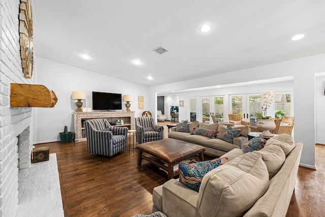 12215 Cobblestone Dr, Houston, TX 77024 - living room with a fireplace, wood finished floors, recessed lighting, and vaulted ceiling