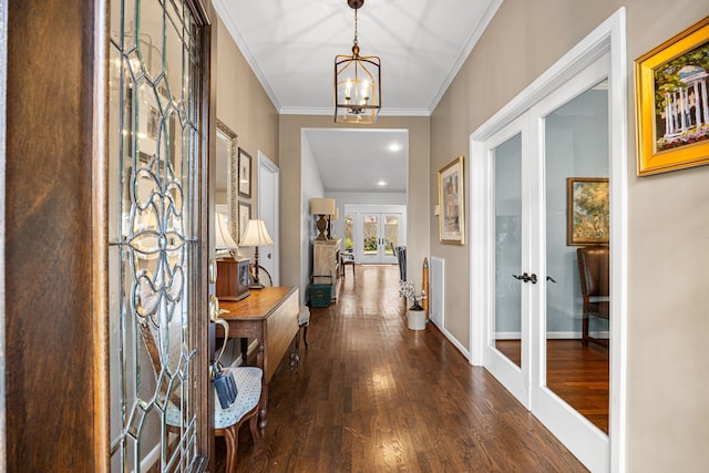 12215 Cobblestone Dr, Houston, TX 77024 - entrance foyer with french doors, dark wood-style floors, a chandelier, and crown molding