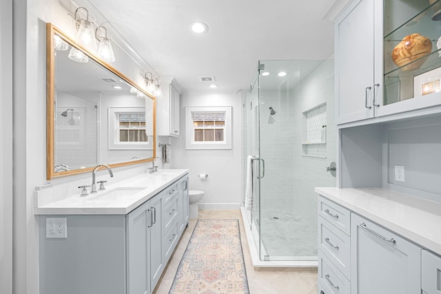 12215 Cobblestone Dr, Houston, TX 77024 - full bathroom with double vanity, a shower stall, recessed lighting, and tile patterned floors