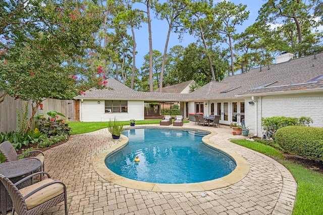 12215 Cobblestone Dr, Houston, TX 77024 - view of pool featuring a fenced backyard, a patio, and french doors