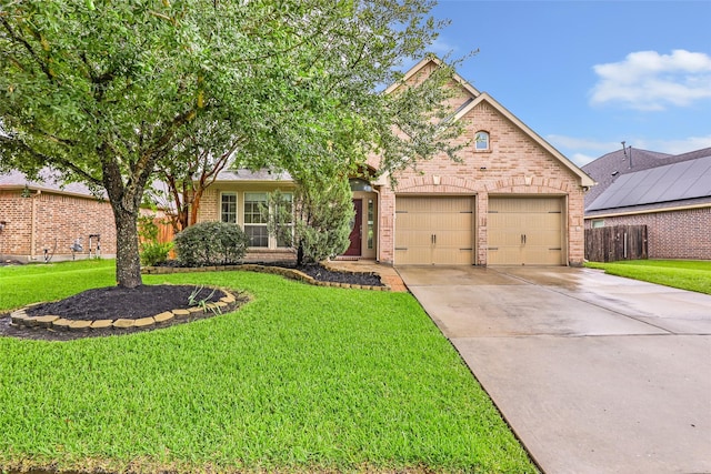 13015 Barkley Bend Ln, Houston, TX 77044 - view of front of house with brick siding, an attached garage, and concrete driveway