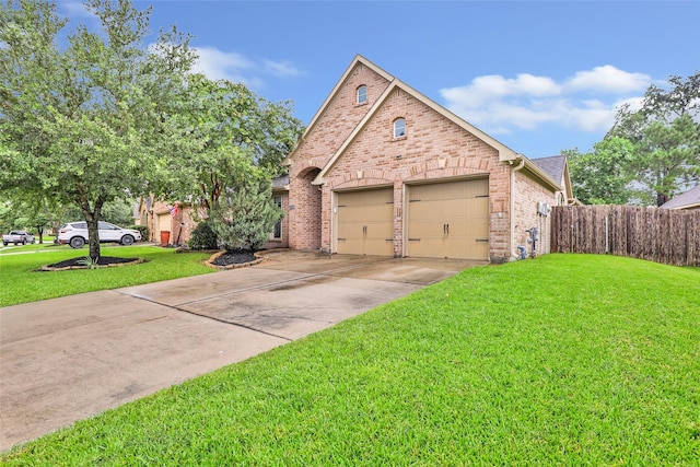 13015 Barkley Bend Ln, Houston, TX 77044 - view of front of house with brick siding, a garage, and driveway