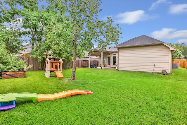 13015 Barkley Bend Ln, Houston, TX 77044 - fenced backyard with a playground and a patio area