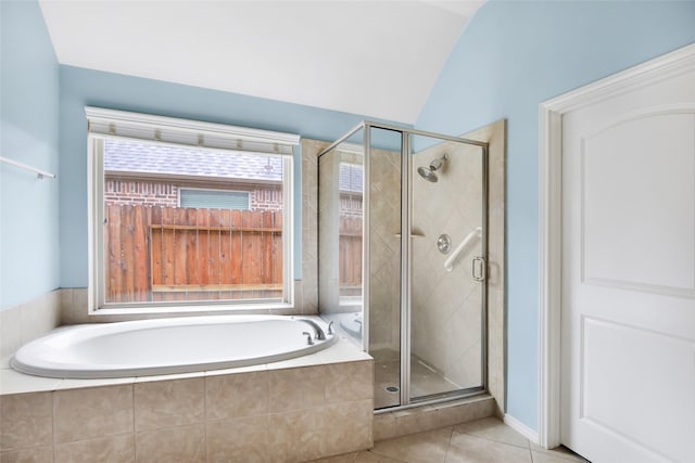 13015 Barkley Bend Ln, Houston, TX 77044 - full bath featuring a bath, tile patterned flooring, a shower stall, plenty of natural light, and lofted ceiling