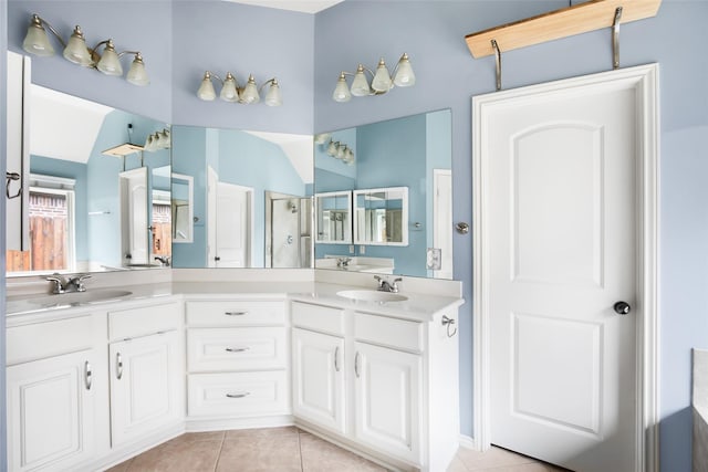 13015 Barkley Bend Ln, Houston, TX 77044 - full bathroom featuring tile patterned floors, a shower with door, double vanity, and vaulted ceiling