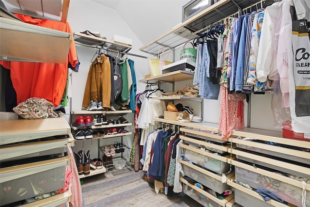 13015 Barkley Bend Ln, Houston, TX 77044 - walk in closet featuring wood finished floors and lofted ceiling