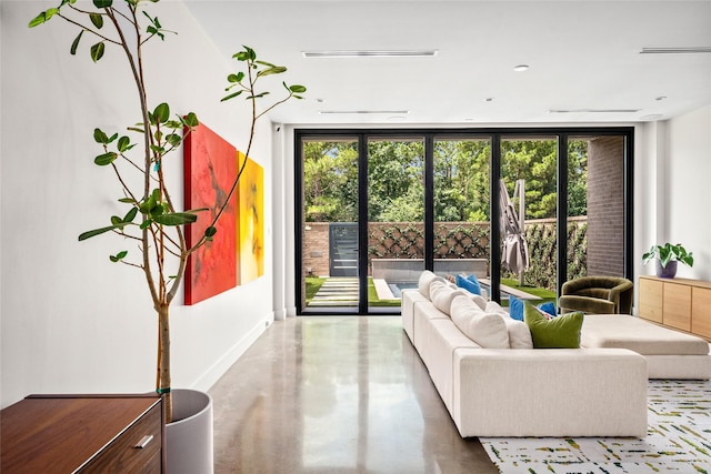 6508 Haskell St, Houston, TX 77007 - living room featuring a wall of windows and finished concrete floors