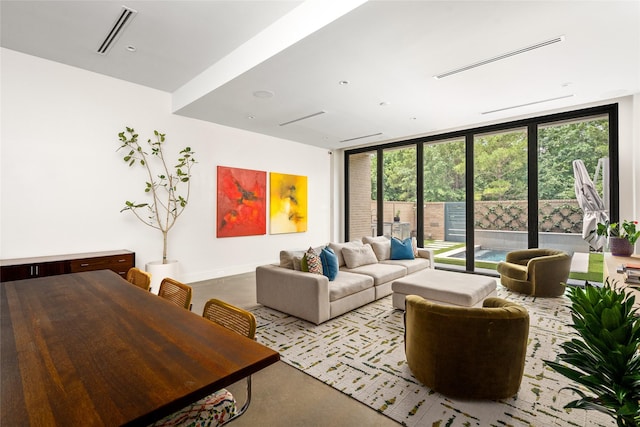 6508 Haskell St, Houston, TX 77007 - living area with finished concrete floors and expansive windows