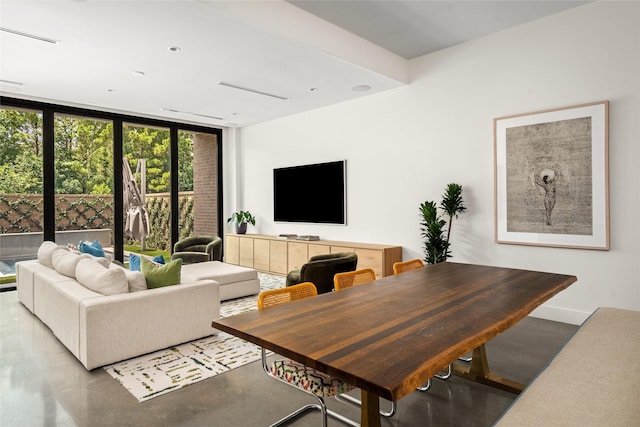 6508 Haskell St, Houston, TX 77007 - living room with floor to ceiling windows and finished concrete floors