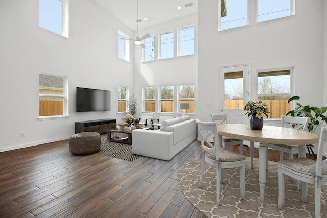 21218 Blue Bluff Dr, Cypress, TX 77433 - living room featuring a towering ceiling, wood finished floors, and recessed lighting