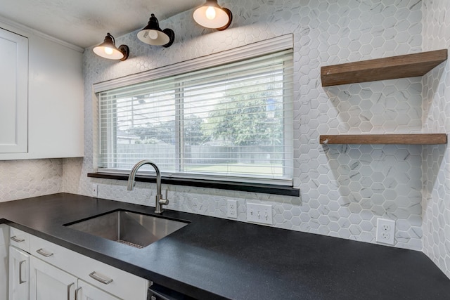 2007 Wakefield Dr, Houston, TX 77018 - kitchen with dark countertops, open shelves, white cabinetry, ornamental molding, and decorative backsplash