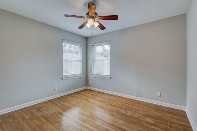2007 Wakefield Dr, Houston, TX 77018 - unfurnished room featuring light wood-style floors, a ceiling fan, and a textured ceiling