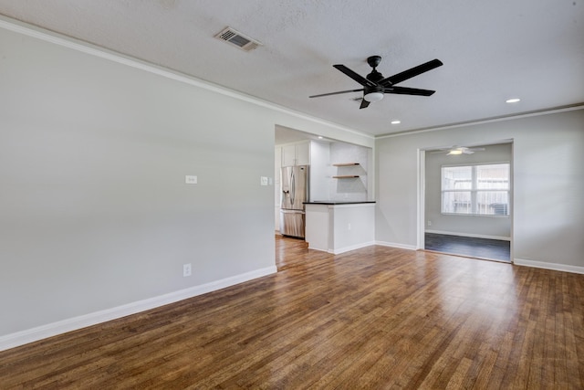 2007 Wakefield Dr, Houston, TX 77018 - unfurnished living room featuring ceiling fan, ornamental molding, dark wood finished floors, and recessed lighting