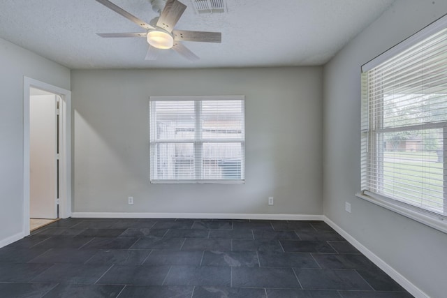 2007 Wakefield Dr, Houston, TX 77018 - unfurnished room with healthy amount of natural light, a textured ceiling, and a ceiling fan