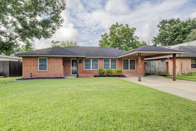 2007 Wakefield Dr, Houston, TX 77018 - ranch-style home with an attached carport, brick siding, concrete driveway, and a shingled roof