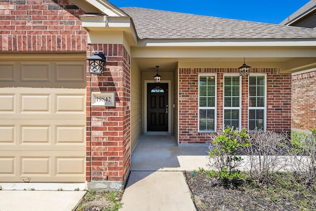 19842 Haven Cliff Ln, Cypress, TX 77433 - entrance to property with brick siding, roof with shingles, an attached garage, and a porch