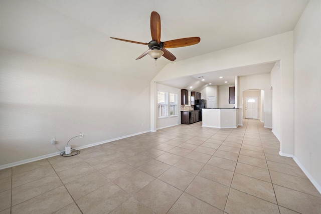 19842 Haven Cliff Ln, Cypress, TX 77433 - unfurnished living room featuring arched walkways, a ceiling fan, vaulted ceiling, light tile patterned flooring, and recessed lighting