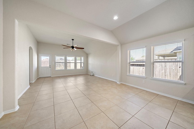 19842 Haven Cliff Ln, Cypress, TX 77433 - unfurnished room featuring lofted ceiling, a ceiling fan, light tile patterned floors, and arched walkways