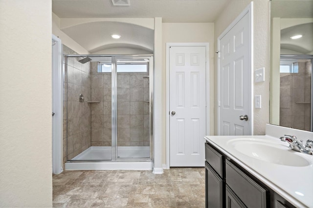 19842 Haven Cliff Ln, Cypress, TX 77433 - bathroom featuring a shower stall and vanity