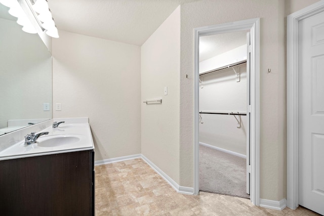 19842 Haven Cliff Ln, Cypress, TX 77433 - bathroom with double vanity and a walk in closet