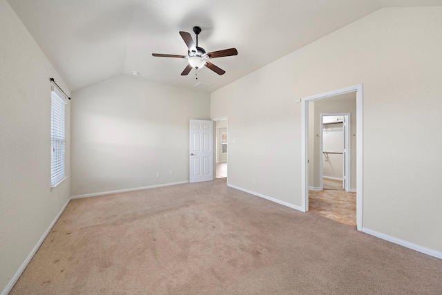 19842 Haven Cliff Ln, Cypress, TX 77433 - unfurnished bedroom with vaulted ceiling, light carpet, and a ceiling fan