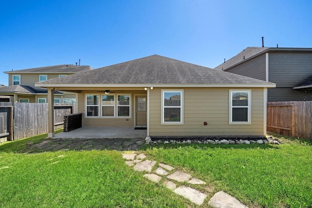 19842 Haven Cliff Ln, Cypress, TX 77433 - back of house with a ceiling fan, a patio, a fenced backyard, and roof with shingles