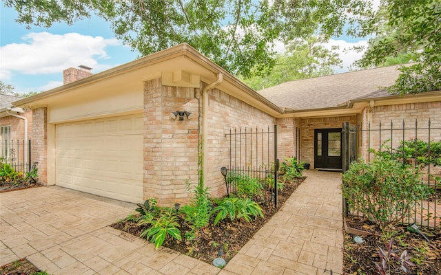 6510 Preston Trail Dr, Houston, TX 77069 - view of front of house with french doors, a garage, brick siding, driveway, and a chimney