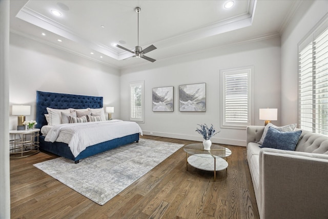 4615 Verone St, Bellaire, TX 77401 - bedroom featuring a raised ceiling, crown molding, multiple windows, wood finished floors, and recessed lighting